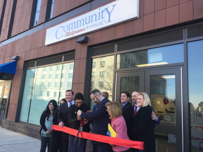 Rutgers-Camden Chancellor Phoebe Haddon and John Colaizzi, Regional Director of Specialty Pharmacy Operations for Walgreens, cut the ribbon on the Community Pharmacy on Federal Street in Camden.