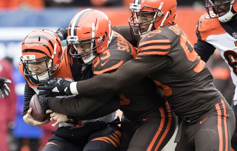 Dec 23, 2018; Cleveland, OH, USA; Cleveland Browns middle linebacker Joe Schobert (53) and defensive end Myles Garrett (95) tackle Cincinnati Bengals quarterback Jeff Driskel (6) during the first quarter at FirstEnergy Stadium. Mandatory Credit: Ken Blaze