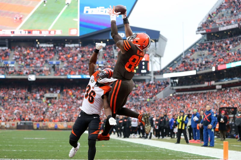Cleveland Browns tight end David Njoku (85) catches a touchdown pass over Cincinnati Bengals strong safety Shawn Williams (36) in the second quarter of a Week 16 NFL football game, Sunday, Dec. 23, 2018, at FirstEnergy Stadium in Cleveland.