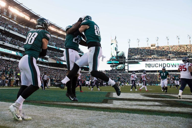 Dec 23, 2018; Philadelphia, PA, USA; Philadelphia Eagles tight end Zach Ertz (86) reacts with running back Wendell Smallwood (28) ad tight end Dallas Goedert (88) after scoring a touchdown against the Houston Texans during the fourth quarter at Lincoln Fi