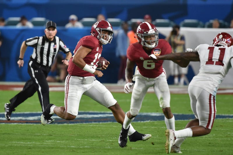 Alabama Crimson Tide quarterback Tua Tagovailoa (13) runs with the ball against the Oklahoma Sooners during the second half of the 2018 Orange Bowl college football playoff semifinal game at Hard Rock Stadium.