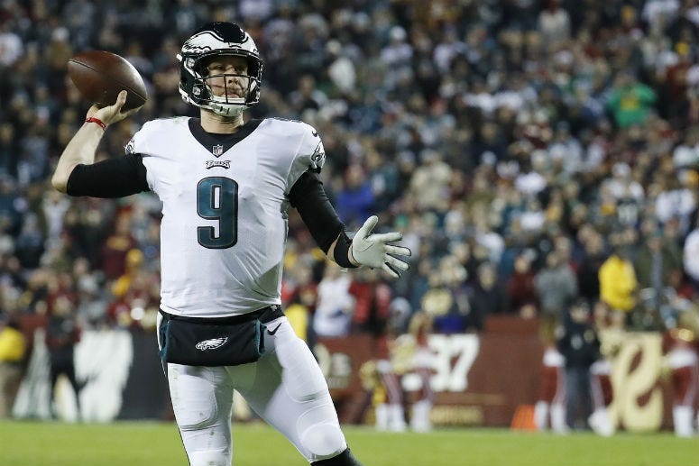 Dec 30, 2018; Landover, MD, USA; Philadelphia Eagles quarterback Nick Foles (9) throws a touchdown pass against the Washington Redskins in the second quarter at FedEx Field. 