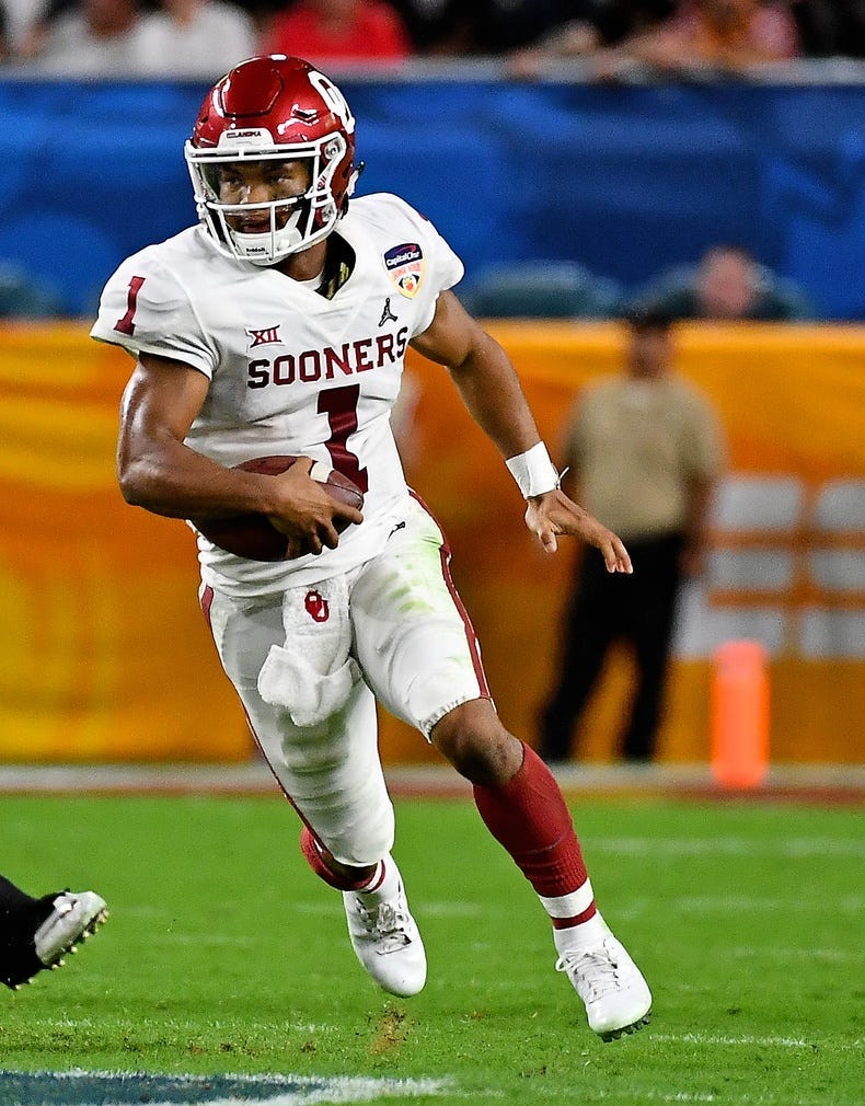 Oklahoma Sooners quarterback Kyler Murray (1) scrambles with the ball against the Alabama Crimson Tide in the 2018 Orange Bowl college football playoff semifinal game at Hard Rock Stadium.