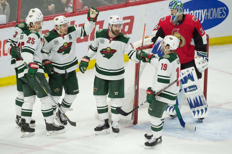 A goal is celebrated by Zach Parise and the Wild