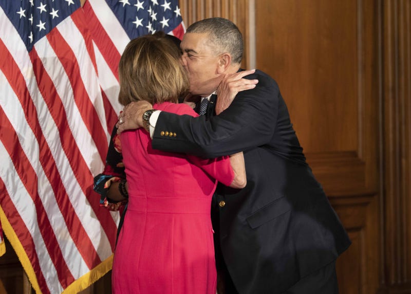 January 3, 2019; Washington, DC, USA; House Speaker Nancy Pelosi (D, CA), receives a hug and kiss from Rep. William Lacy Clay (D, MO) before his ceremonial swearing in to Congress on January 3, 2019 in Washington D.C.