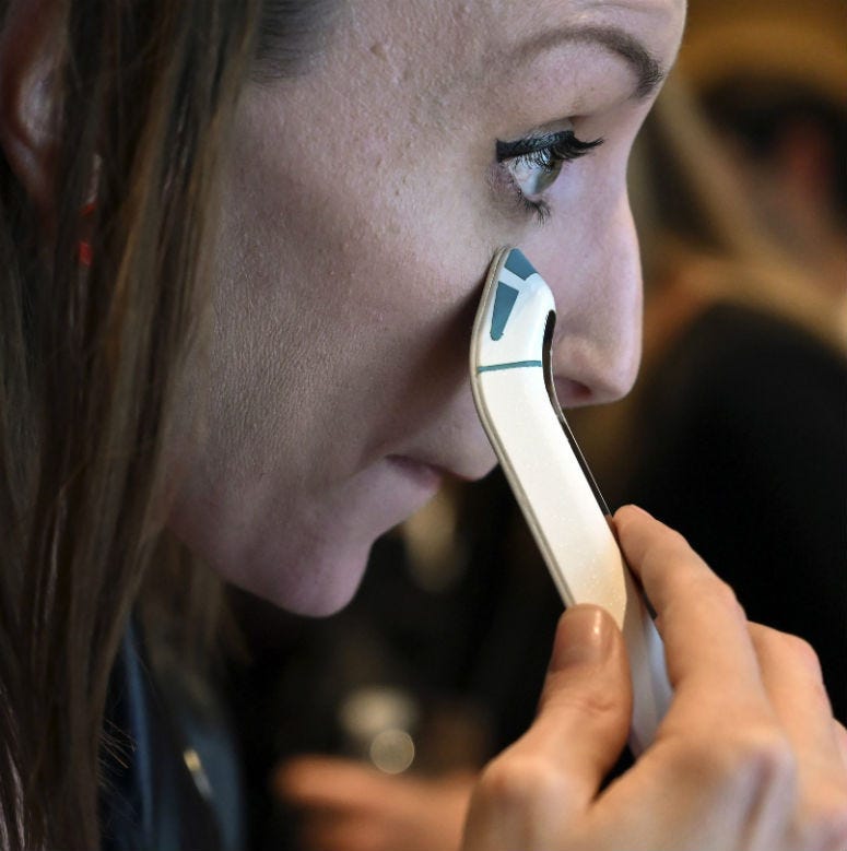 January 7, 2019; Las Vegas, NV, USA; Jessica Conditt tries Olay's electromagnetic FaceWand at Digital Experience, a media preview event at the Mirage Events Center.