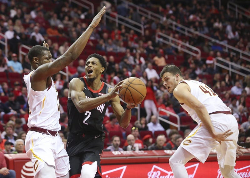 Jan 11, 2019; Houston, TX, USA; Houston Rockets guard Brandon Knight (2) spilts the defense of Cleveland Cavaliers guard Collin Sexton (2) and center Ante Zizic (41) in the second half at Toyota Center. Mandatory Credit: Thomas B. Shea-USA TODAY Sports