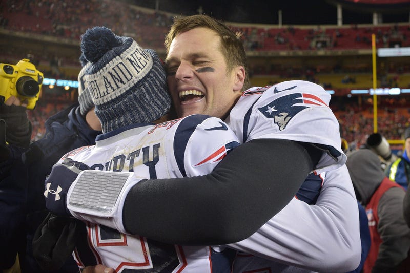 Tom Brady hugs Devin McCourty