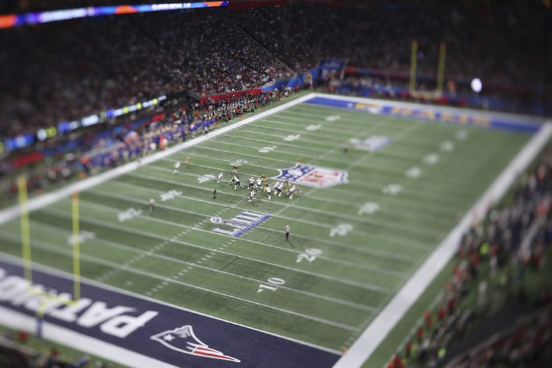Feb 3, 2019; Atlanta, GA, USA; EDITORS NOTE : A tilt-shift lens was used to make this photograph. The New England Patriots run a play in the first quarter of Super Bowl LIII at Mercedes-Benz Stadium. Mandatory Credit: Kevin Jairaj-USA TODAY Sports
