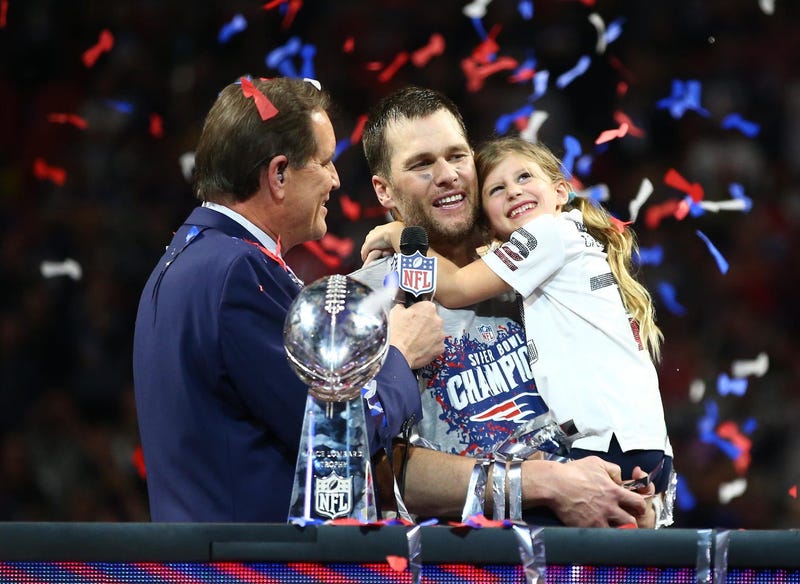 Feb 3, 2019; Atlanta, GA, USA; New England Patriots quarterback Tom Brady (12) and daughter Vivian celebrate as they are interviewed by CBS host Jim Nantz after Super Bowl LIII against the Los Angeles Rams at Mercedes-Benz Stadium. Mandatory Credit: Mark
