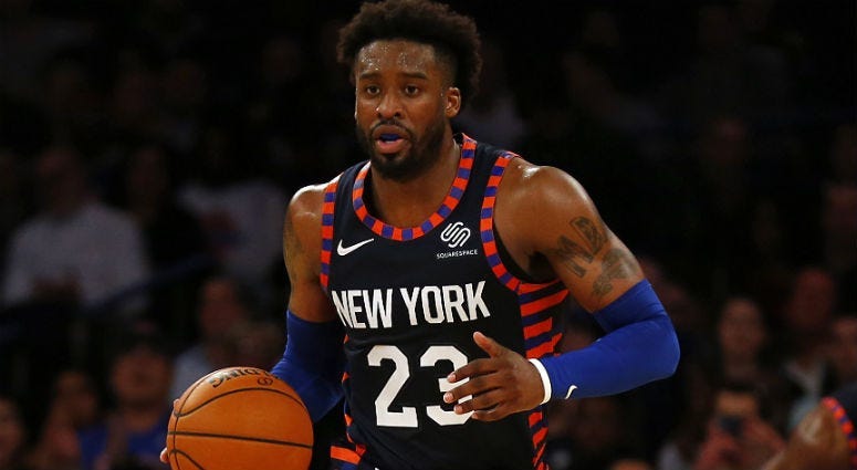 Wesley Matthews brings the ball up court against the Detroit Pistons during the second half at Madison Square Garden.