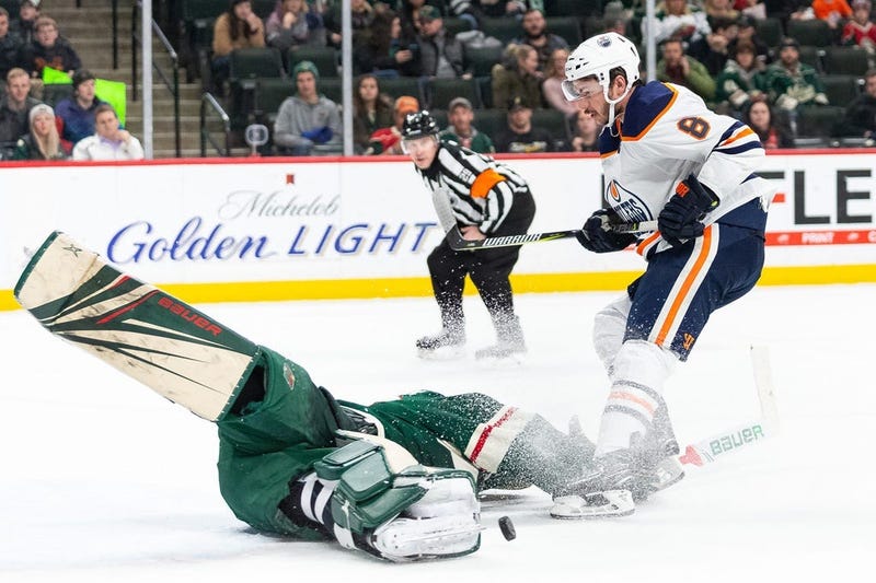 Wild goaltender Devan Dubnyk takes on Ty Rattie of Edmonton
