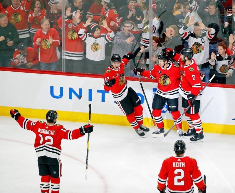 Blackhawks forward Dominik Kahun celebrates a goal against the Red Wings.