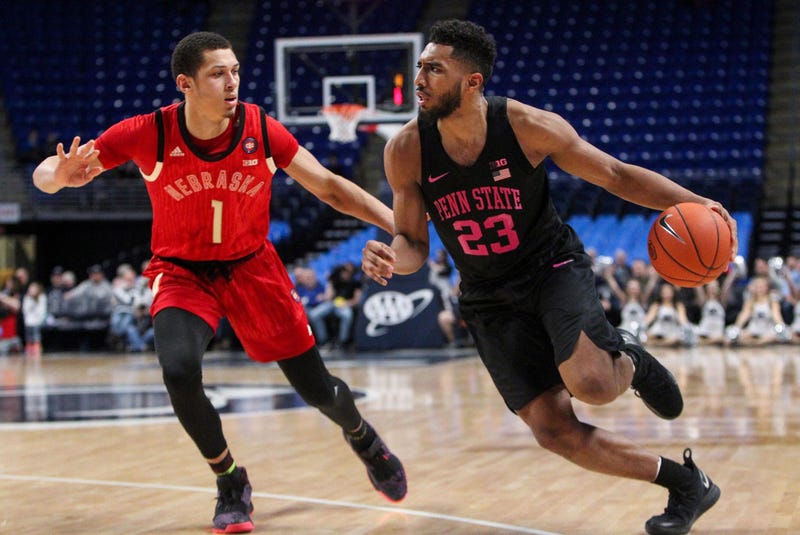 Feb 19, 2019; University Park, PA, USA; Penn State Nittany Lions guard Josh Reaves (23) dribbles the ball around Nebraska Cornhuskers guard Amir Harris (1) during the first half at Bryce Jordan Center.