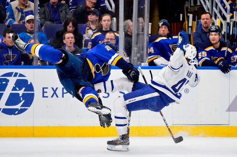 Toronto Maple Leafs center Nazem Kadri (43) is checked by St. Louis Blues defenseman Vince Dunn (29) during the first period at Enterprise Center. 