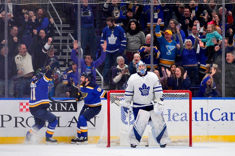 St. Louis Blues center Ryan O'Reilly (90) celebrates with right wing Vladimir Tarasenko (91) after scoring the game winning goal against Toronto Maple Leafs goaltender Frederik Andersen (31) during overtime at Enterprise Center. 