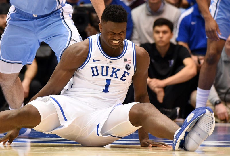 Duke Blue Devils forward Zion Williamson (1) reacts after falling during the first half against the North Carolina Tar Heels at Cameron Indoor Stadium.