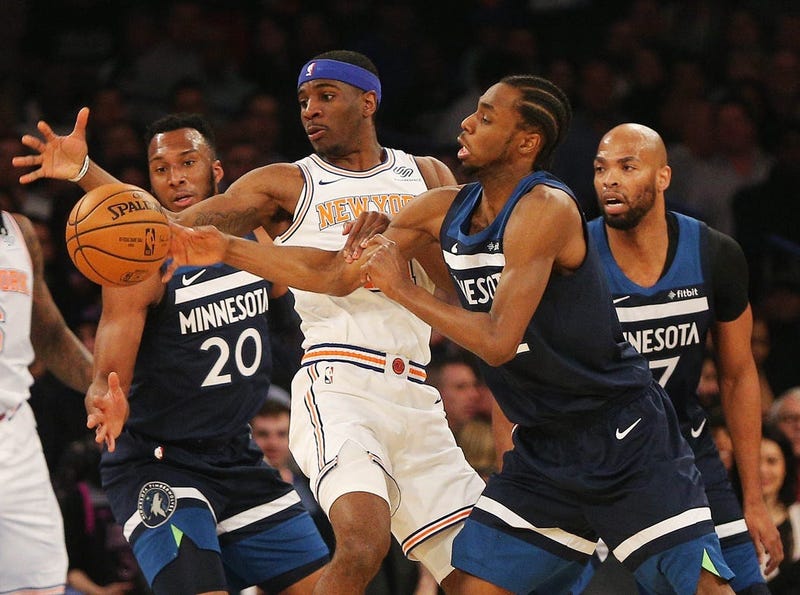 Andrew Wiggins goes for a loose ball