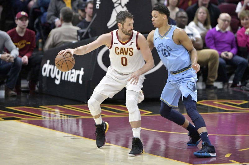 Feb 23, 2019; Cleveland, OH, USA; Cleveland Cavaliers forward Kevin Love (0) dribbles against Memphis Grizzlies forward Ivan Rabb (10) in the first quarter at Quicken Loans Arena. Mandatory Credit: David Richard-USA TODAY Sports