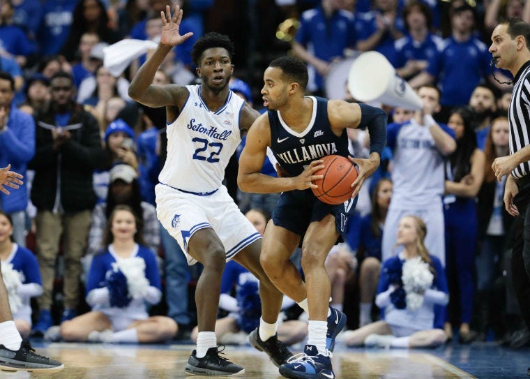 Mar 9, 2019; Newark, NJ, USA; Villanova Wildcats guard Phil Booth (5) shields the ball from Seton Hall Pirates guard Myles Cale (22) during the seance half at Prudential Center. 