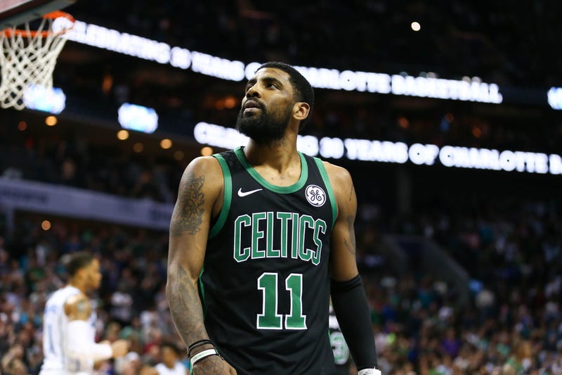Mar 23, 2019; Charlotte, NC, USA; Boston Celtics guard Kyrie Irving (11) watches a replay after a foul in the second half against the Charlotte Hornets at Spectrum Center. Mandatory Credit: Jeremy Brevard-USA TODAY Sports