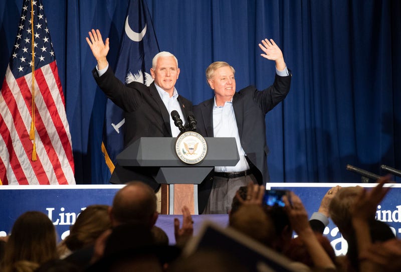 Vice President Mike Pence (left) and Sen. Lindsey Graham wave to the crowd gathered in the Greenville Marriott Saturday, Mar. 30, 2019 after speaking at Senator Lindsey Graham s Upstate Kickoff Reception.