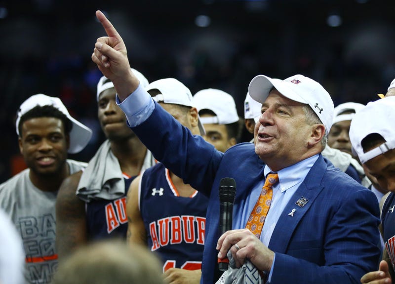 Auburn coach Bruce Pearl and his Tigers celebrate after advancing to the Final Four.
