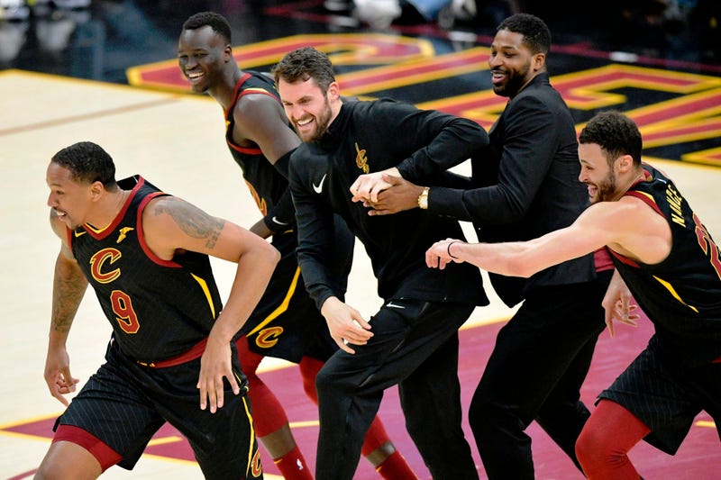 Apr 9, 2019; Cleveland, OH, USA; Cleveland Cavaliers forward Channing Frye (left) is chased by his teammates after making a three-point basket in the fourth quarter against the Charlotte Hornets at Rocket Mortgage FieldHouse. Mandatory Credit: David Richa