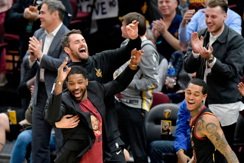 Apr 9, 2019; Cleveland, OH, USA; Cleveland Cavaliers forward Kevin Love (0), back left, center Tristan Thompson (13), front left, and guard Jordan Clarkson (8) celebrate a three-point basket by forward Channing Frye (not pictured) in the fourth quarter ag