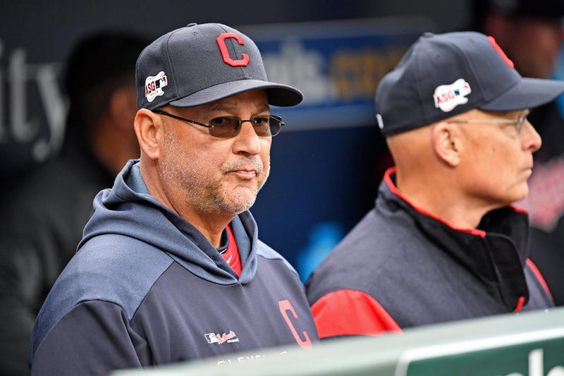 Cleveland Indians manager Terry Francona (left) looks on from the dugout before the start of the game against the Kansas City Royals at Kauffman Stadium.