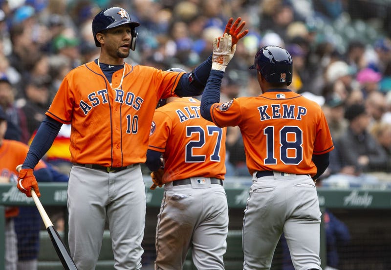 Yuli Gurriel celebrates with Tony Kemp