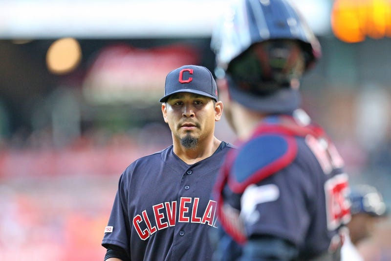 Cleveland Indians catcher Roberto Perez (55) gives starting pitcher Carlos Carrasco (59) a fist bump after striking out Houston Astros shortstop Carlos Correa (1) to end the third inning at Minute Maid Park. 
