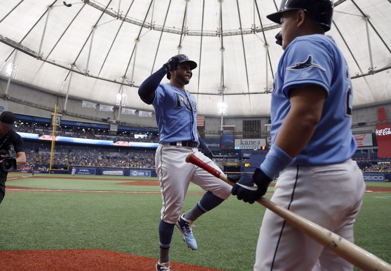 un 16, 2019; St. Petersburg, FL, USA; Tampa Bay Rays left fielder Tommy Pham (29) is congratulated by first baseman Ji-Man Choi (26)