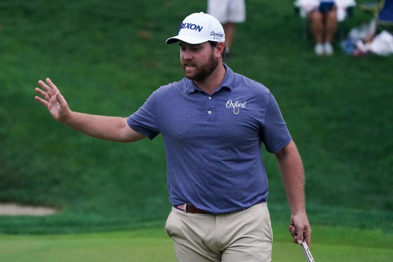 Zack Sucher reacts after his birdie on the 18th green during the first round of the Travelers Championship golf tournament at TPC River Highlands.