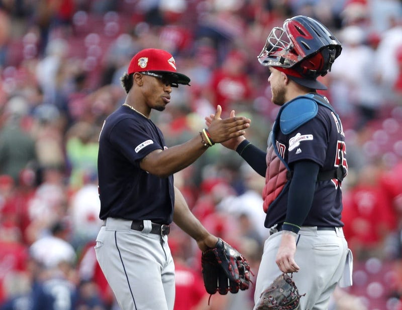Jul 6, 2019; Cincinnati, OH, USA; Cleveland Indians shortstop Francisco Lindor (left) and catcher Roberto Perez (55) react after the Indians defeated the Cincinnati Reds at Great American Ball Park. Mandatory Credit: David Kohl-USA TODAY Sports