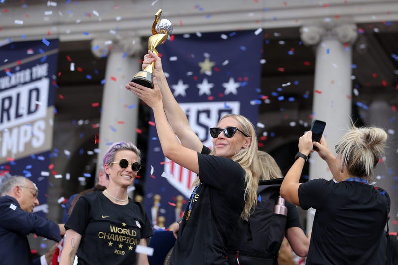United States women's national soccer team midfielder Allie Long (20) celebrates with the trophy at New York City Hall after the ticker-tape parade for the United States women's national soccer team down the canyon of heroes in New York City