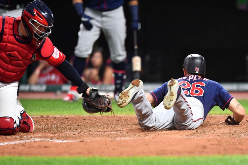 Jul 12, 2019; Cleveland, OH, USA; Minnesota Twins right fielder Max Kepler (26) slides into home as Cleveland Indians catcher Roberto Perez (55) is late with the tag during the seventh inning at Progressive Field. Mandatory Credit: Ken Blaze-USA TODAY Spo