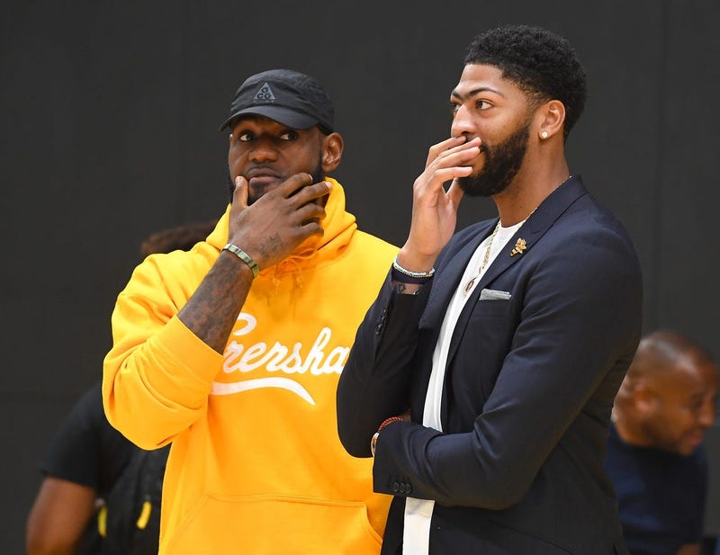 Jul 13, 2019; El Segundo, CA, USA; Los Angeles Lakers forward LeBron James (left) talks with forward/center Anthony Davis (right) after a press conference at the UCLA Health Training Center.