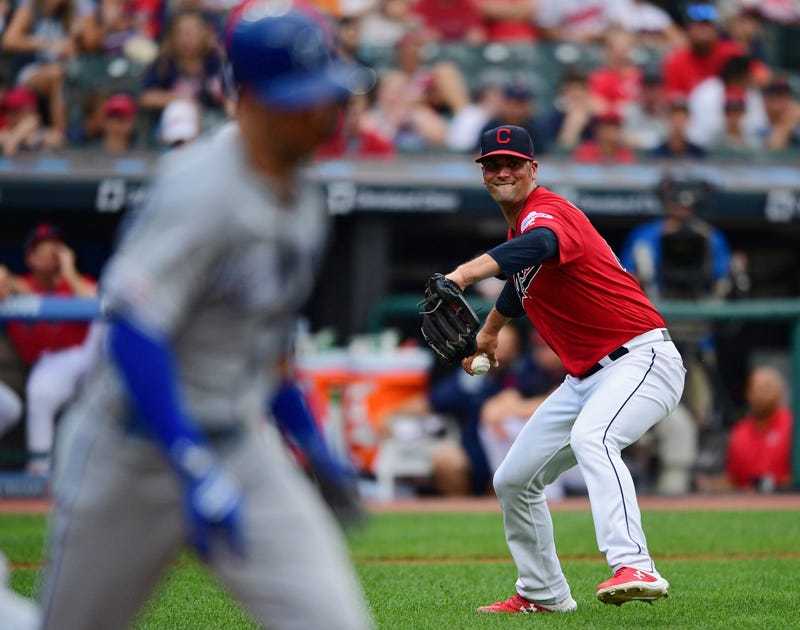 Jul 20, 2019; Cleveland, OH, USA; Cleveland Indians starting pitcher Adam Plutko (45) attempts to throw out Kansas City Royals right fielder Whit Merrifield (15) (not pictured) during the third inning at Progressive Field. 