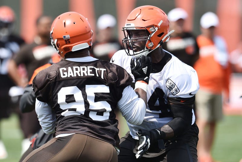Cleveland Browns defensive end Myles Garrett (95) rushes against offensive tackle Chris Hubbard (74) during training camp at the Cleveland Browns Training Complex. 