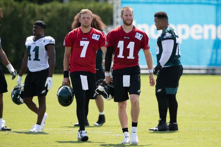 Jul 26, 2019; Philadelphia, PA, USA; Philadelphia Eagles quarterback Carson Wentz (11) and quarterback Nate Sudfeld (7) during training camp at Novacare Complex.