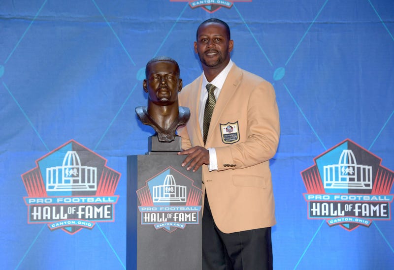 Ty Law poses with bust during the Pro Football Hall of Fame Enshrinement