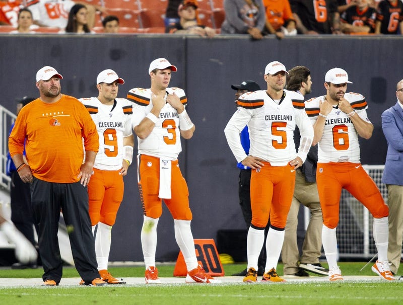 Cleveland Browns head coach Freddie Kitchens stands on the sidelines with quarterbacks David Blough (9), Garrett Gilbert (3), Drew Stanton (5) and Baker Mayfield (6)