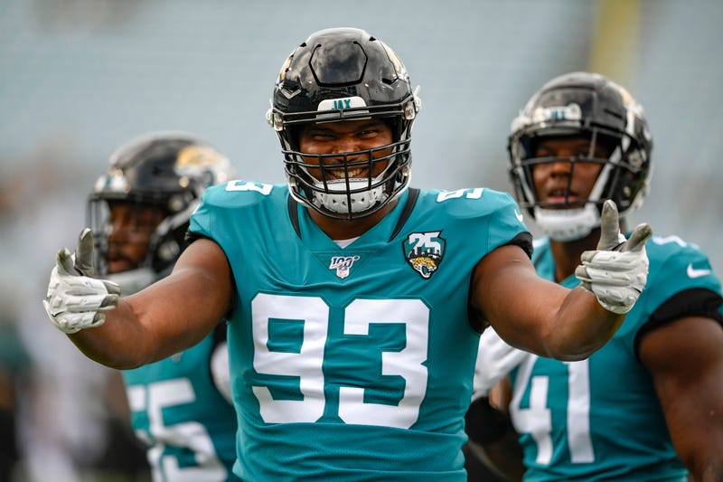 Calais Campbell poses for a photo before a Jaguars game