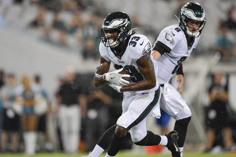 Aug 15, 2019; Jacksonville, FL, USA; Philadelphia Eagles quarterback Clayton Thorson (8) hands the ball off to running back Josh Adams (33) for a touchdown against the Jacksonville Jaguars during the third quarter at TIAA Bank Field.
