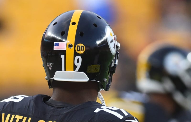 The Pittsburgh Steelers wear a DD decal on their helmets in honor of late coach Darryl Drake at Heinz Field