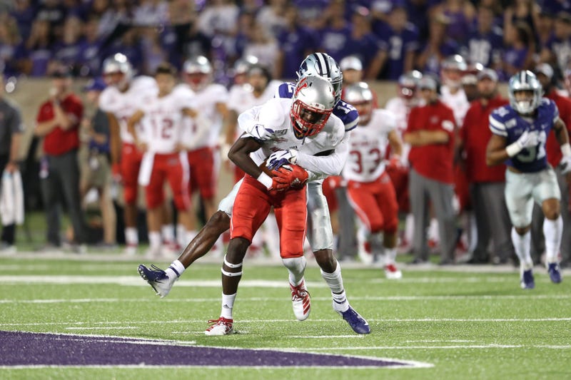 Nicholls State Colonels wide receiver Dai'Jean Dixon (5) is tackled by Kansas State Wildcats defensive back AJ Parker (12) during the fourth quarter at Bill Snyder Family Stadium. 