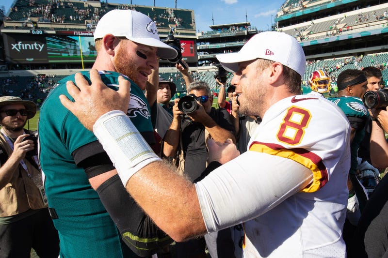 Philadelphia Eagles quarterback Carson Wentz (11) and Washington Redskins quarterback Case Keenum (8) shake hands on the field after the game at Lincoln Financial Field.