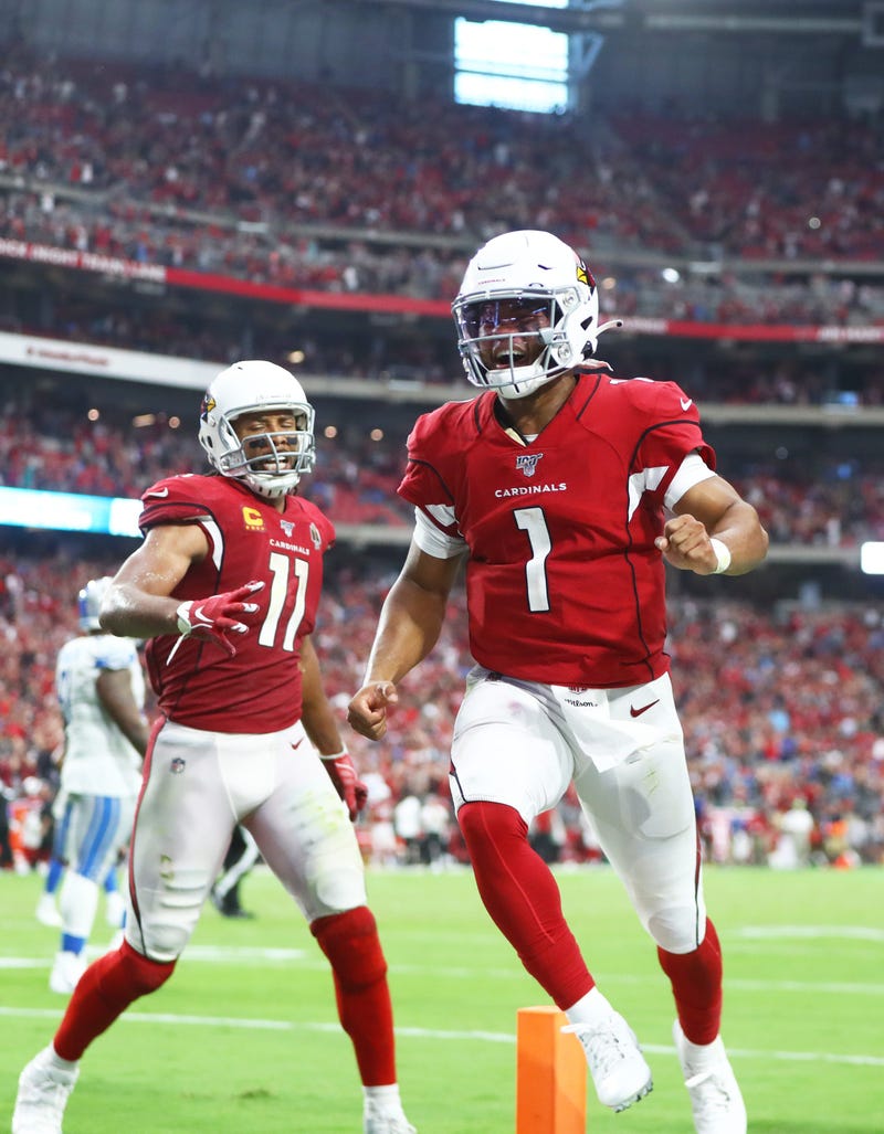 Arizona Cardinals quarterback Kyler Murray (1) and wide receiver Larry Fitzgerald (11) celebrate a game tying two point conversion in the fourth quarter against the Detroit Lions at State Farm Stadium.