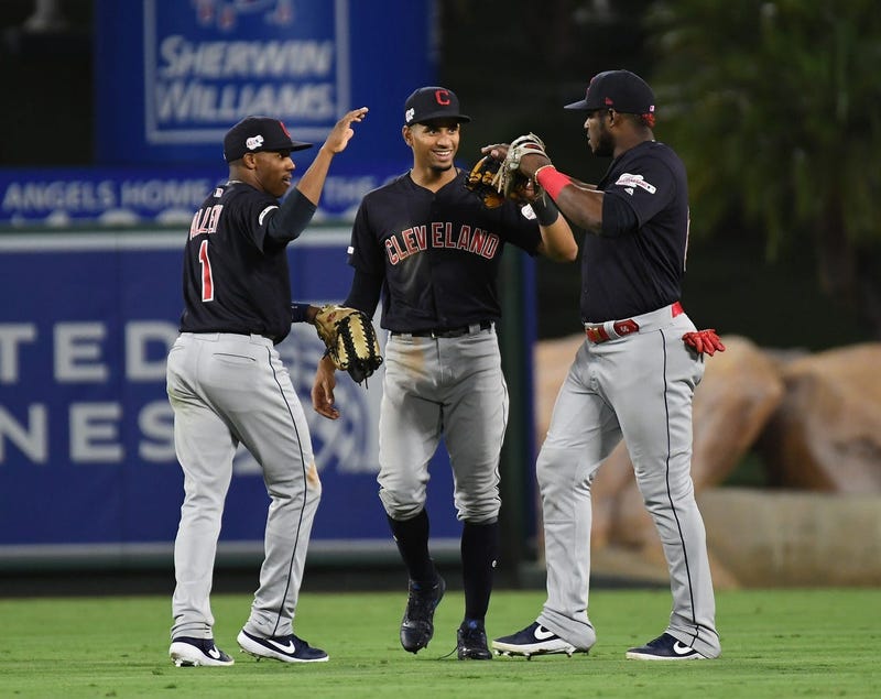 Sep 9, 2019; Anaheim, CA, USA; Cleveland Indians left fielder Greg Allen (1) and center fielder Oscar Mercado (35) and right fielder Yasiel Puig (66) celebrate after defeating the Los Angeles Angels at Angel Stadium of Anaheim. Mandatory Credit: Richard M